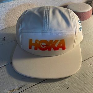 White Hoka running hat. One size fits all. Never worn. Perfect Condition.